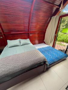 Postel nebo postele na pokoji v ubytování Glamping Campo Alegre