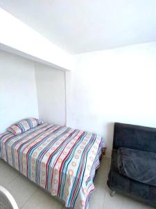 Ένα ή περισσότερα κρεβάτια σε δωμάτιο στο 2023 Apartamentos Múltiples Segundo Piso Casa Independiente