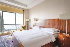 Postelja oz. postelje v sobi nastanitve Qabila Westbay Hotel