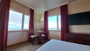 TV a/nebo společenská místnost v ubytování Hotel Diego de Almagro Punta Arenas