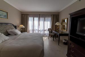 Postel nebo postele na pokoji v ubytování Cairo World Trade Center Hotel & Residences