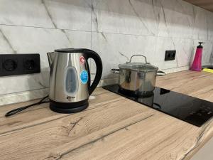a toaster sitting on top of a kitchen counter at Апартаменты Soul Park in Astana