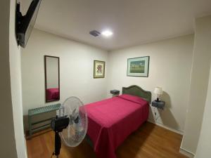 A bed or beds in a room at Intimo Hotel Los Heroes
