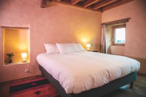 Łóżko lub łóżka w pokoju w obiekcie Eco lodge Carbonaccio