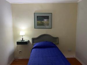 A bed or beds in a room at Intimo Hotel Los Heroes
