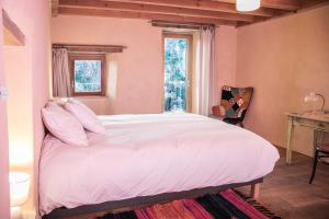 Łóżko lub łóżka w pokoju w obiekcie Eco lodge Carbonaccio
