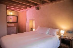 Łóżko lub łóżka w pokoju w obiekcie Eco lodge Carbonaccio