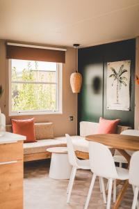 a living room with a couch and a table at Regenbogen Bad Gandersheim in Bad Gandersheim