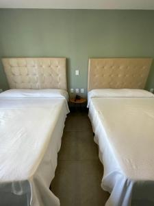 Cama o camas de una habitación en Flat 708 no Hotel Ilusion