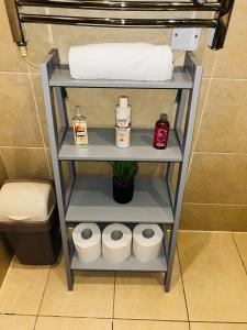 a shelf in a bathroom with towels and toiletries at Modern&Large 3bed 3Bath Central London Air-Con Hyde Park in London