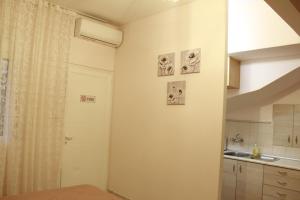 a bathroom with a sink and a shower curtain at Apartment Eirina in Athens