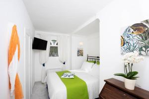 Cama ou camas em um quarto em Villa Dalu