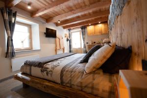 Säng eller sängar i ett rum på Le Camere di Naturalys