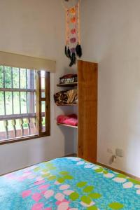 Giường trong phòng chung tại Finca Manantial, tu casa de descanso en el oriente