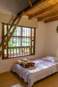 Ένα ή περισσότερα κρεβάτια σε δωμάτιο στο Finca Manantial, tu casa de descanso en el oriente