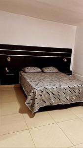 Una cama o camas en una habitación de M&D alojamiento