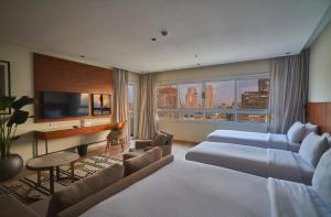 a hotel room with two beds and a piano at The President Hotel Cairo in Cairo