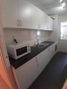 Kuchyň nebo kuchyňský kout v ubytování Apartamento Ángel