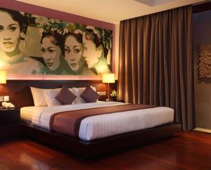 Ein Bett oder Betten in einem Zimmer der Unterkunft Mahagiri Villas Sanur