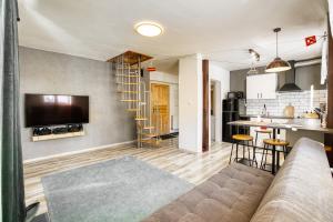 Kuchyňa alebo kuchynka v ubytovaní Apartmány Pod Šerákem