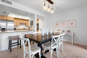 a kitchen and dining room with a table and chairs at Fairway Dream - Sawgrass 2 Bedrooms - 2 Bath Villas Sleep 6, Close To Beach in Ponte Vedra Beach