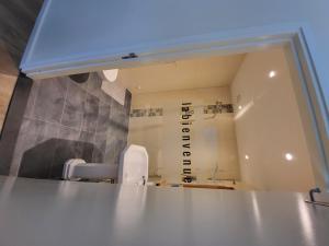 a view of a bathroom with a sink and a mirror at Heerlijk Appartement 'la bienvenue' in Venlo, Limburg in Venlo