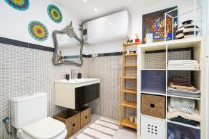 a bathroom with a toilet and a sink at For You Rentals Teatro Real Plaza Apartment Saint Martin Madrid TRU5 in Madrid