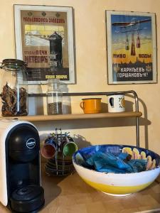 a counter with a coffee maker and a bowl on a table at L'Antico Casale in Bisacquino