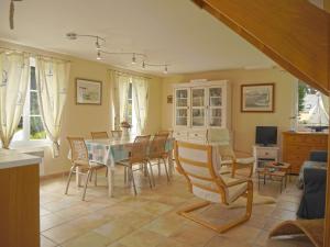 a dining room with a table and chairs at Maison de qualité avec jardin paysager à Sauzon - FR-1-418-38 in Sauzon