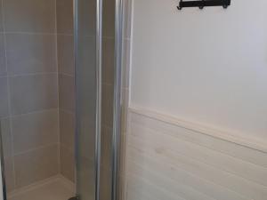 a shower with a glass door in a bathroom at Maison lumineuse avec jardin à Sauzon, proche plage - FR-1-418-70 in Sauzon