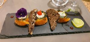 a plate with some food on a table at Grand Hotel de la Vallée in Cheylade