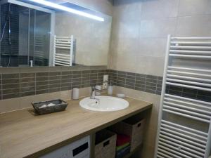 a bathroom with a sink and a mirror at Studio Le Palais, 1 pièce, 4 personnes - FR-1-418-73 in Le Palais