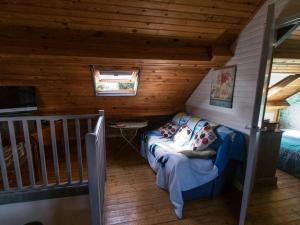 a small room with a couch in a cabin at Appartement Le Palais, 3 pièces, 4 personnes - FR-1-418-83 in Le Palais