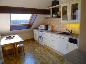 a kitchen with a sink and a washing machine at Duplex F2 avec terrasse vue lac, parking et WiFi – Annecy - FR-1-432-5 in Annecy