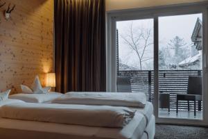 Voodi või voodid majutusasutuse Hotel Heini toas