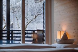 Voodi või voodid majutusasutuse Hotel Heini toas