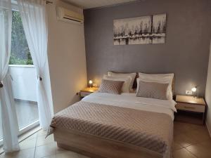 Posteľ alebo postele v izbe v ubytovaní Apartments Joško