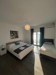 Posteľ alebo postele v izbe v ubytovaní Blue Art Apartment