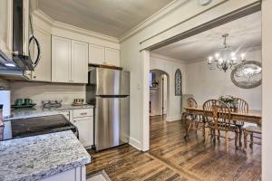 a kitchen and dining room with a table and a refrigerator at Lexington Vacation Rental 1 Mi to UK! in Lexington