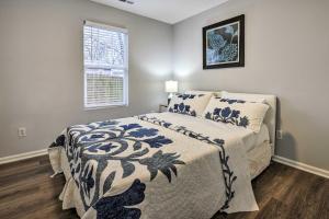 a bedroom with a bed and a window at Renovated Raleigh Home half Mi to Downtown! in Raleigh