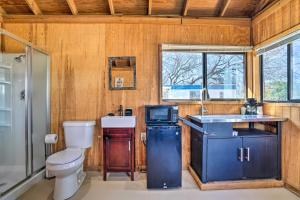 a bathroom with a toilet and a sink at Waterfront Studio with Fire Pit on Lake Dunlap! in New Braunfels