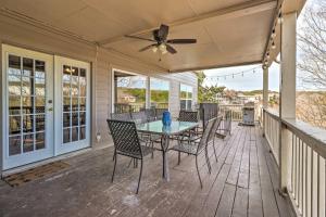 a patio with a table and chairs on a deck at Lakefront Home with Point Venture Golf Access! in Point Venture