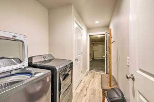a small laundry room with a washer and dryer at Belgrade Vacation Rental with Mountain Views! in Belgrade