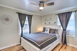 a bedroom with a bed and a ceiling fan at Grand Junction Vacation Rental with Fire Pit! in Grand Junction