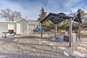 a pergola in front of a house at Grand Junction Vacation Rental with Fire Pit! in Grand Junction