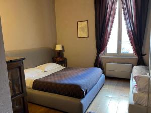 Postel nebo postele na pokoji v ubytování A Casa Di Paola Suite