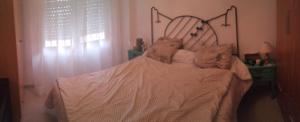 A bed or beds in a room at Appartement bord de mer-Aguilas