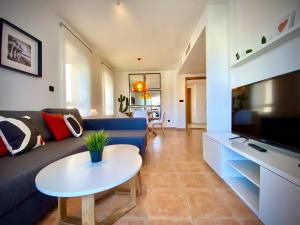 TV a/nebo společenská místnost v ubytování Renteando Albir Apartments