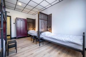 Postel nebo postele na pokoji v ubytování Vola Hostel