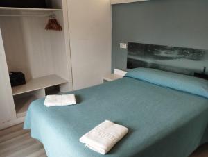 Postel nebo postele na pokoji v ubytování Hotel Raxa